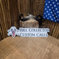 Three different sizes of logo stickers with a design that includes a skull, crossed sticks, and the text 'BILL COLLECTOR CUSTOM CALLS'. The stickers come in white with black lettering, clear with white lettering, and a combination of white and black with the flag of the United States.
