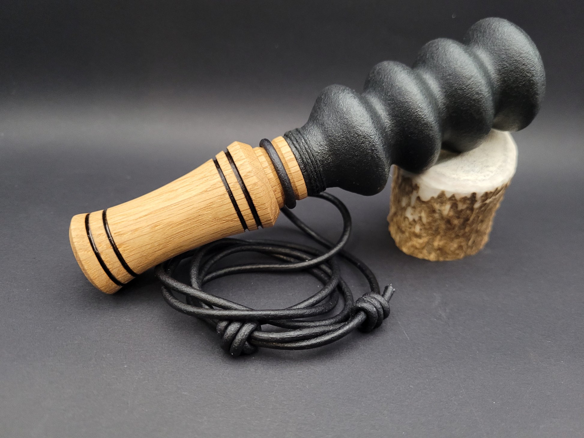 Handcrafted wooden double reed squirrel call in White Oak